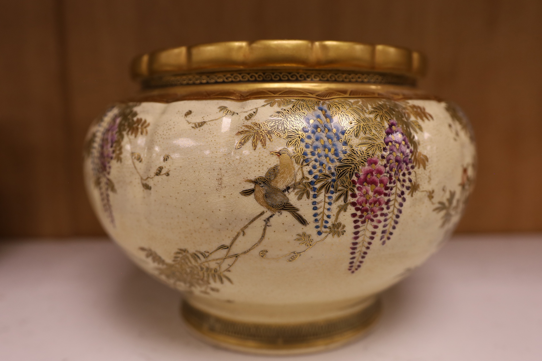 A Japanese Satsuma large bowl, 15cm high. Condition - heavily stain inside some grazing to lower rim and gilt scuffed on top rim of bowl